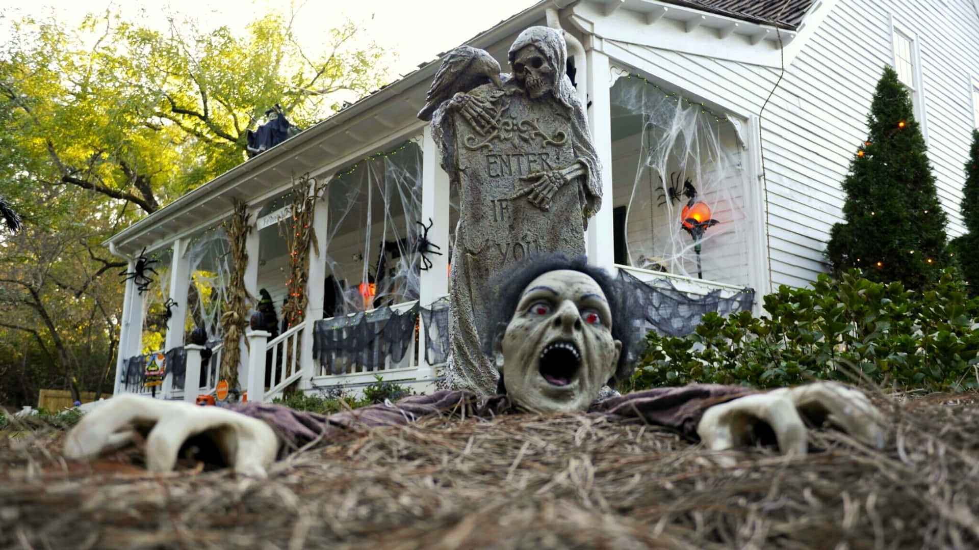 A House With A Halloween Decoration In The Front Yard