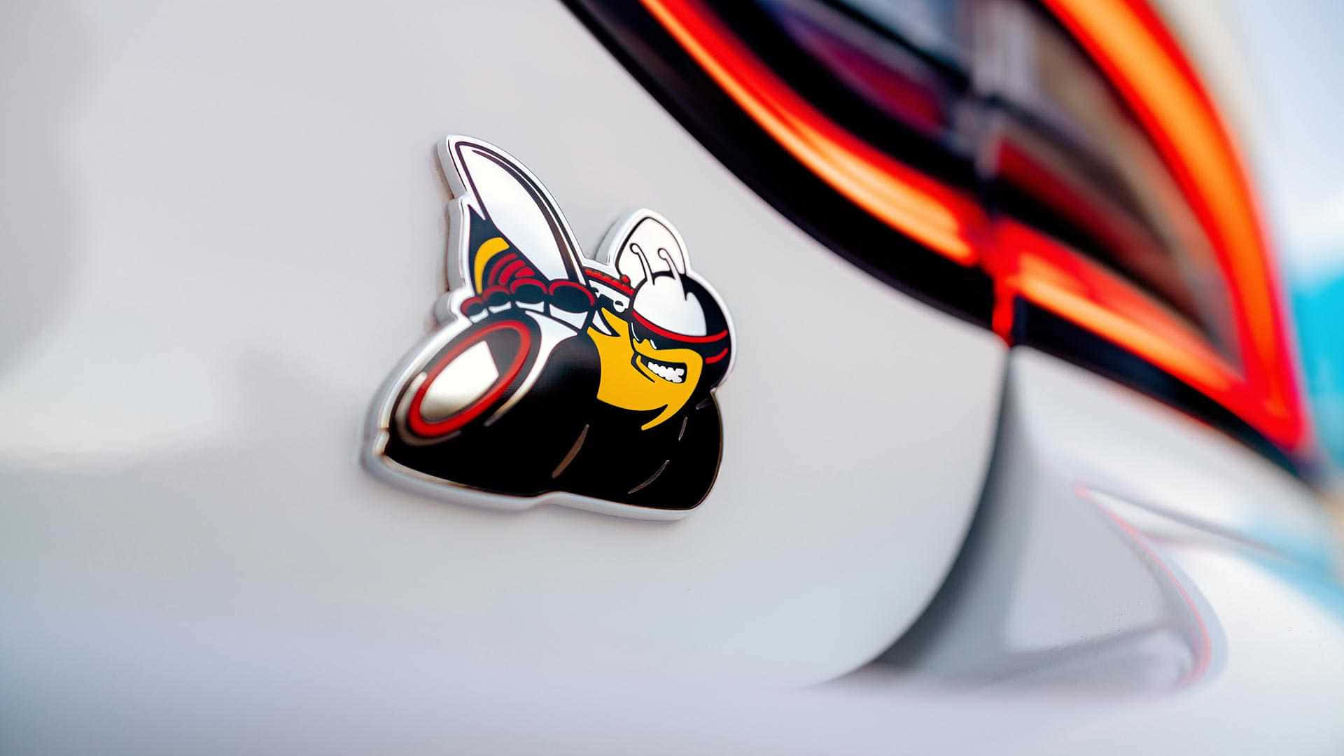 A Car With A Cartoon Character On The Back Of It Wallpaper
