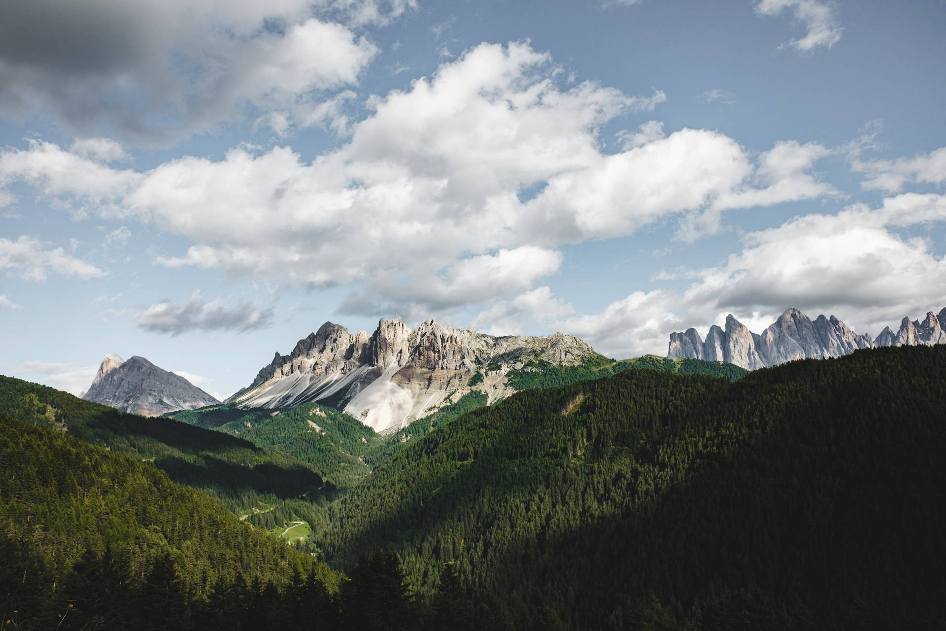 Enjoy the views from the enchanting summer Alpine Mountain Wallpaper