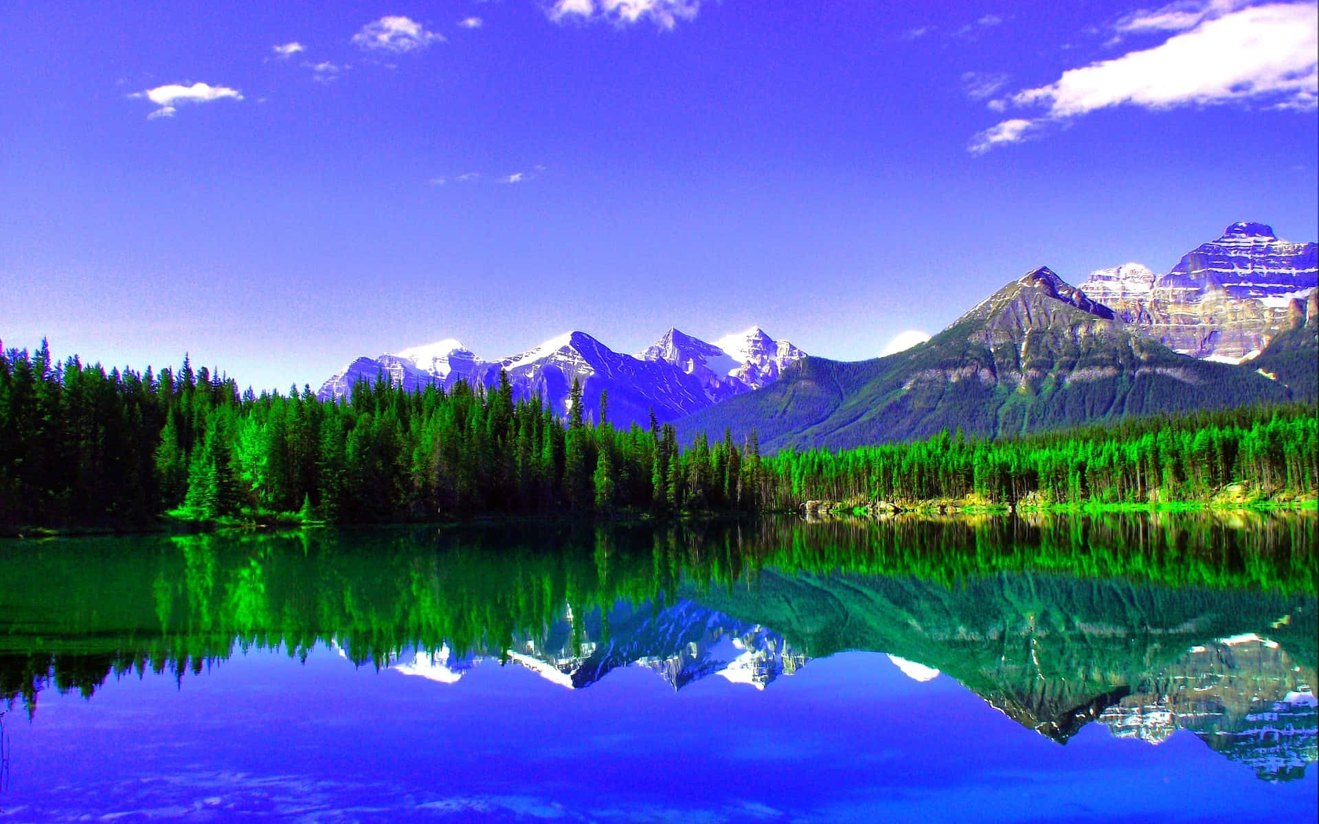 A Lake With Mountains Reflected In It