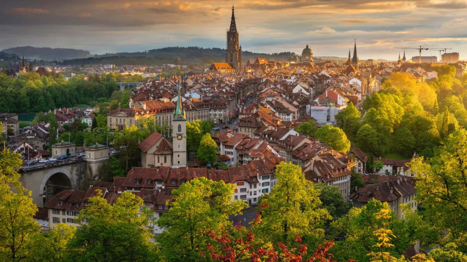 Scenic View Of Bern Cityscape And Swiss Alps Wallpaper