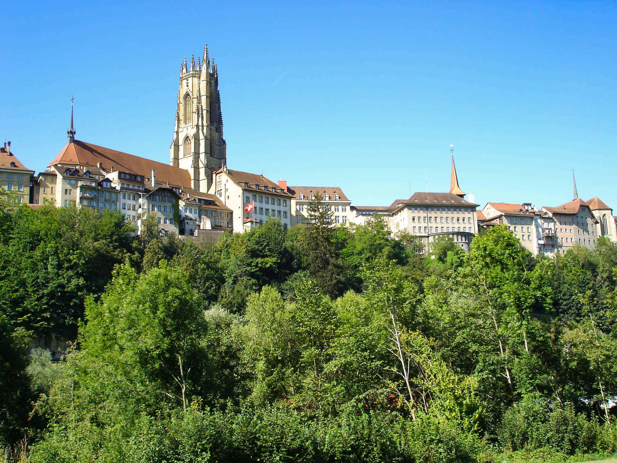"scenic View Of The Saint Nicholas Cathedral In Fribourg, Switzerland" Wallpaper