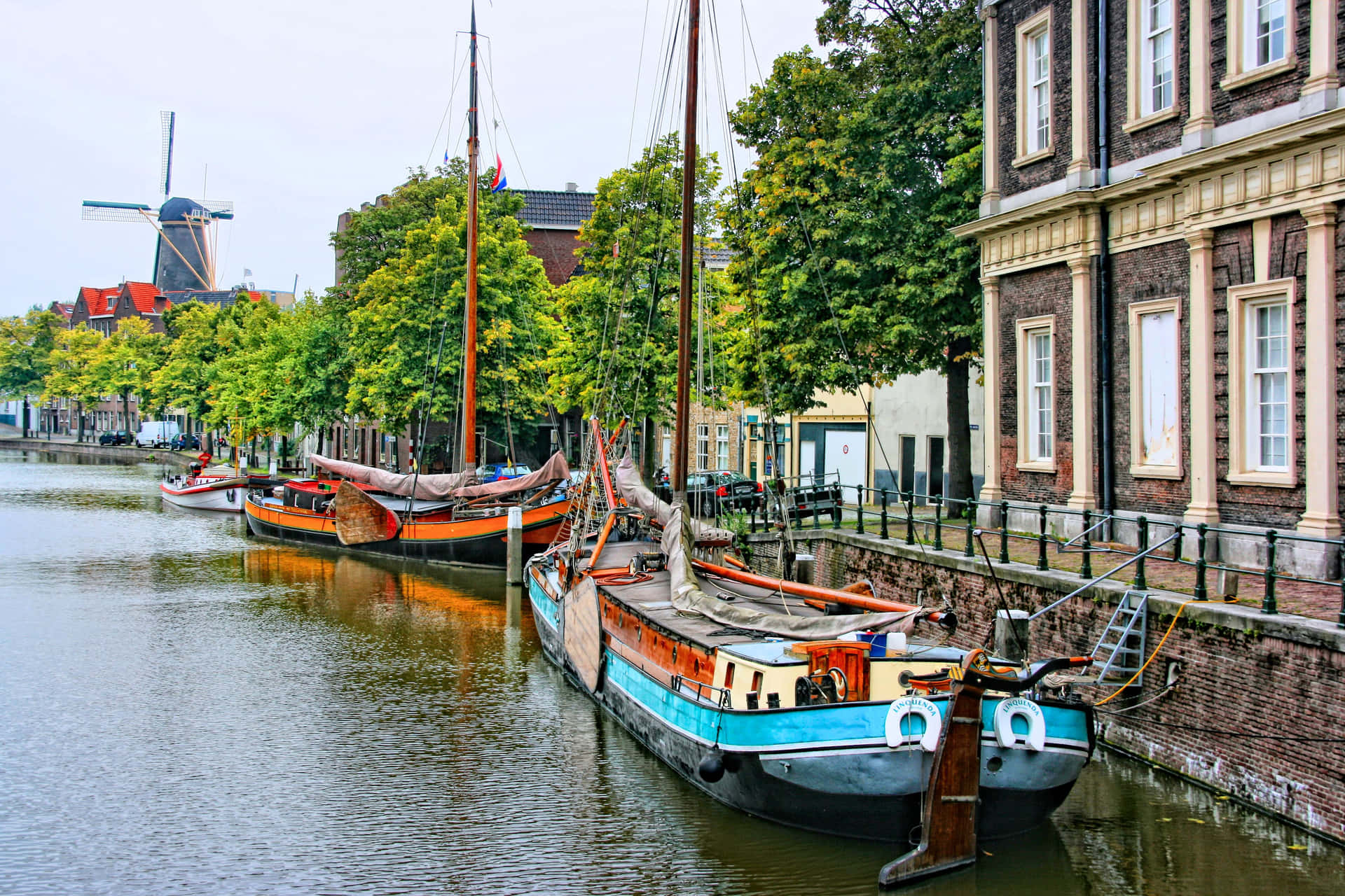 Schiedam Canal Viewwith Windmilland Boats Wallpaper