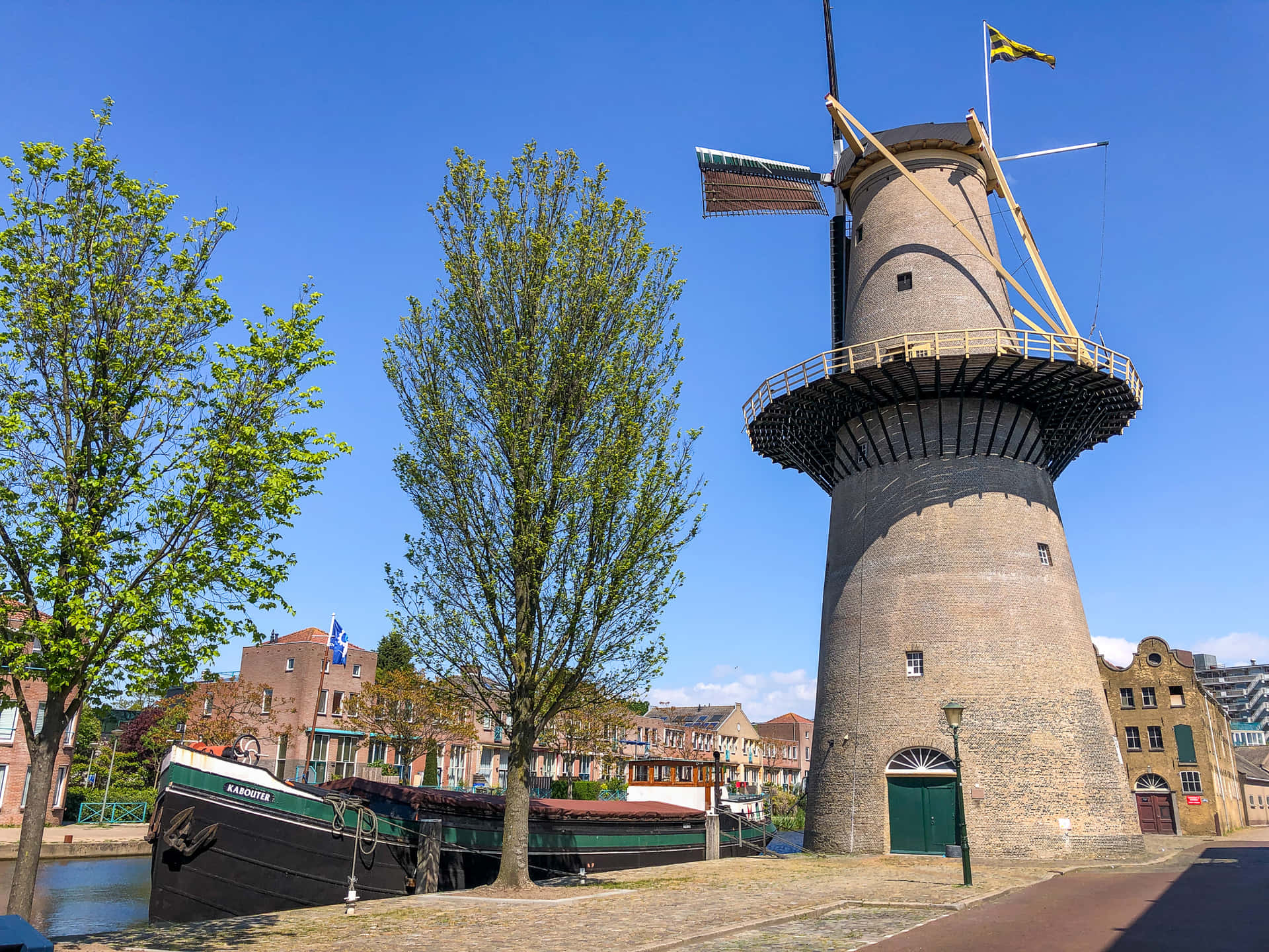 Download Schiedam Windmilland Canal Boat Wallpaper | Wallpapers.com