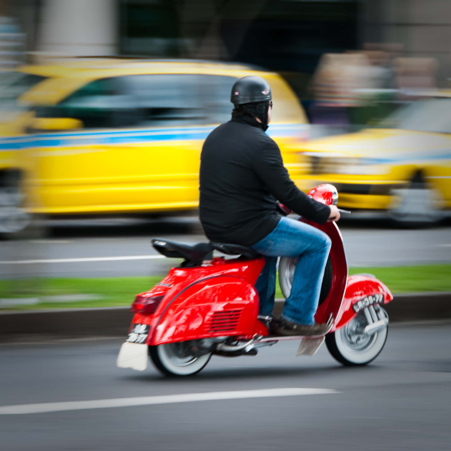 Scooter Man Riding A Red Moped Picture