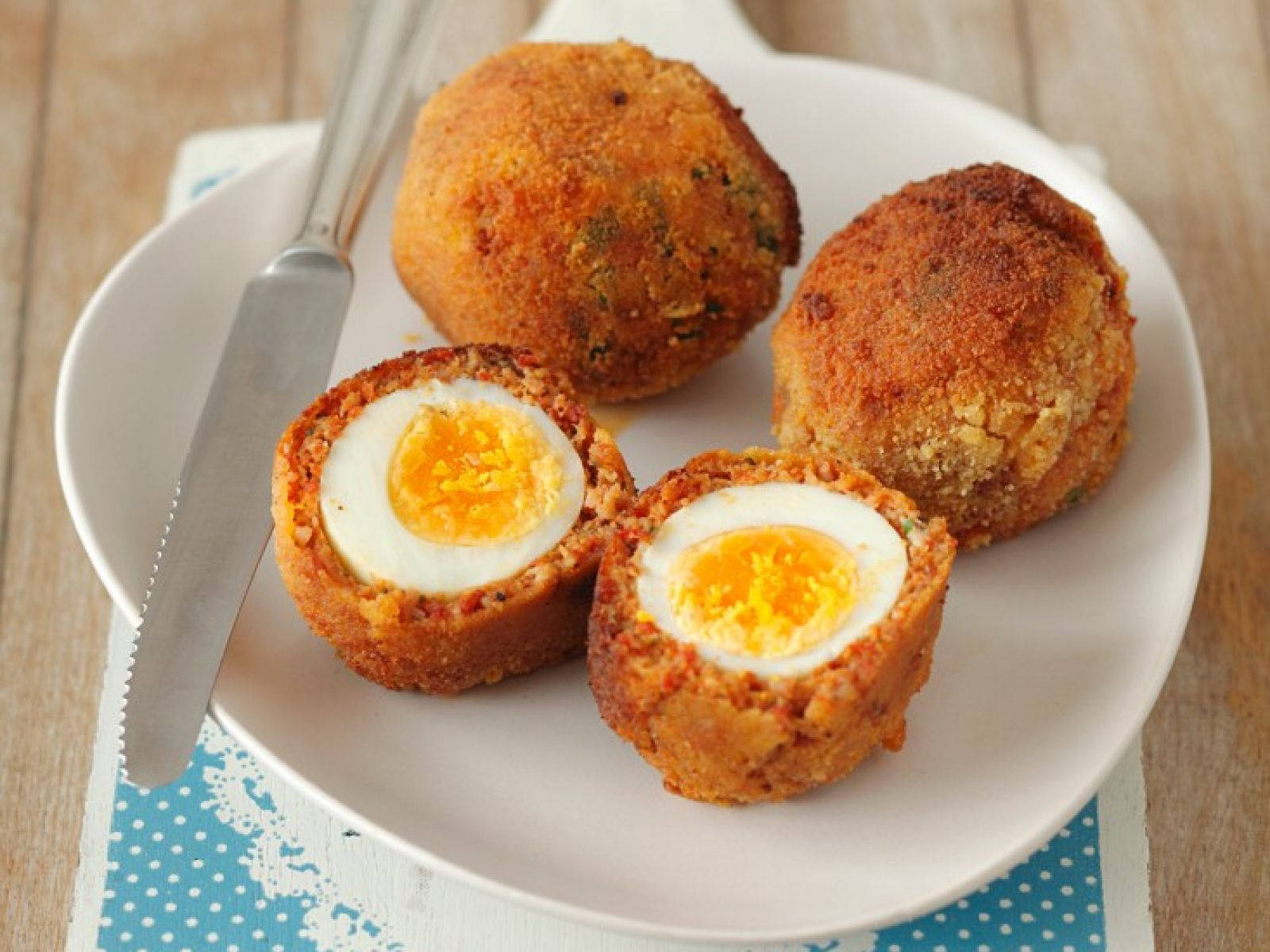 Scotch Eggs And Dinner Knife On A Plate Wallpaper