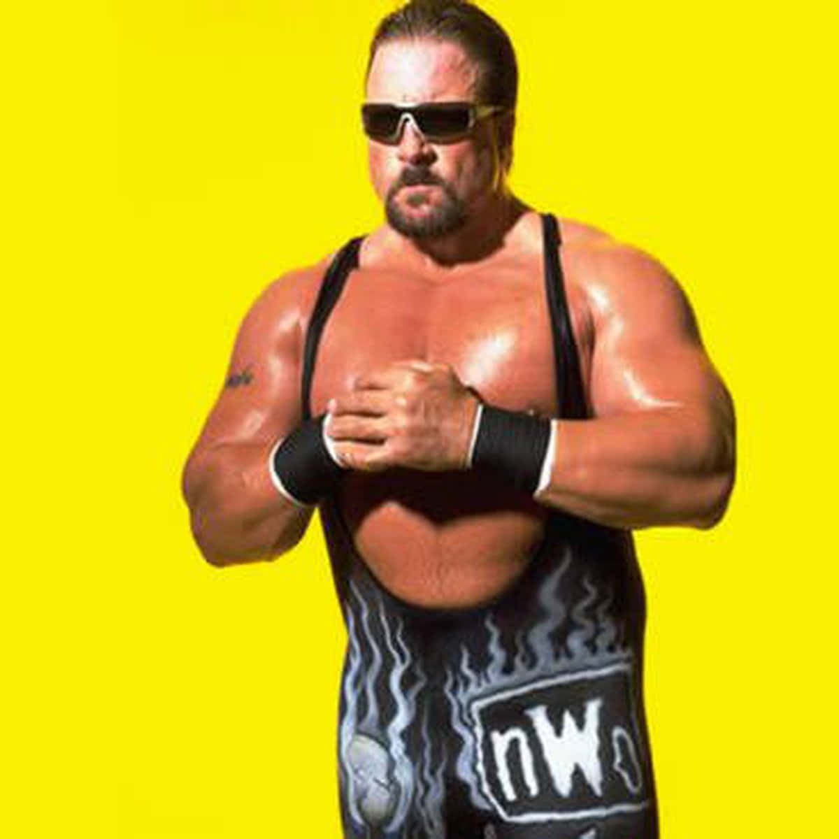 Scott Norton striking a pose in his iconic black singlet against a vibrant yellow background Wallpaper