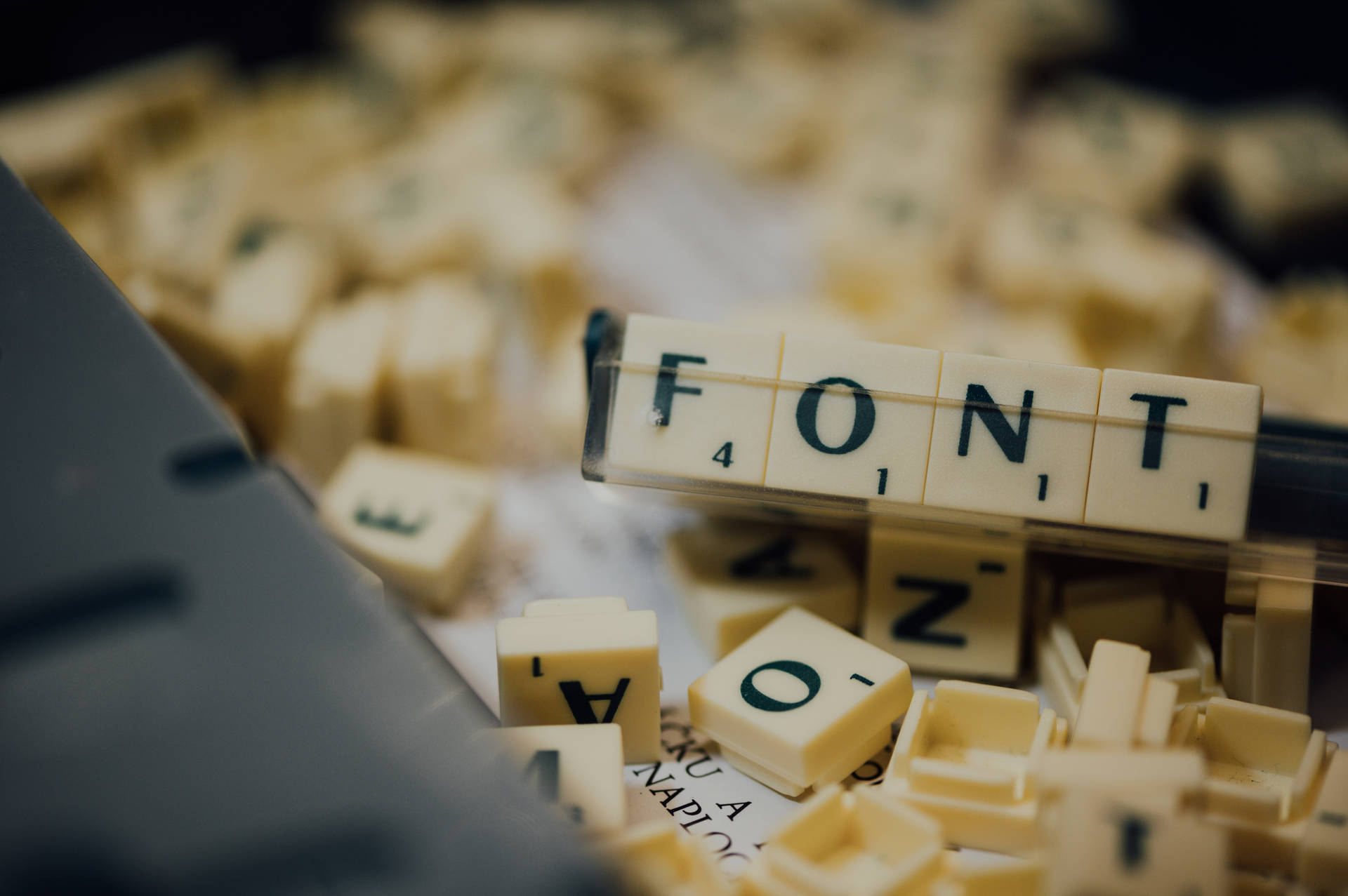 Caption: Close-up of Scrabble Tiles Spelling "FONT" Wallpaper