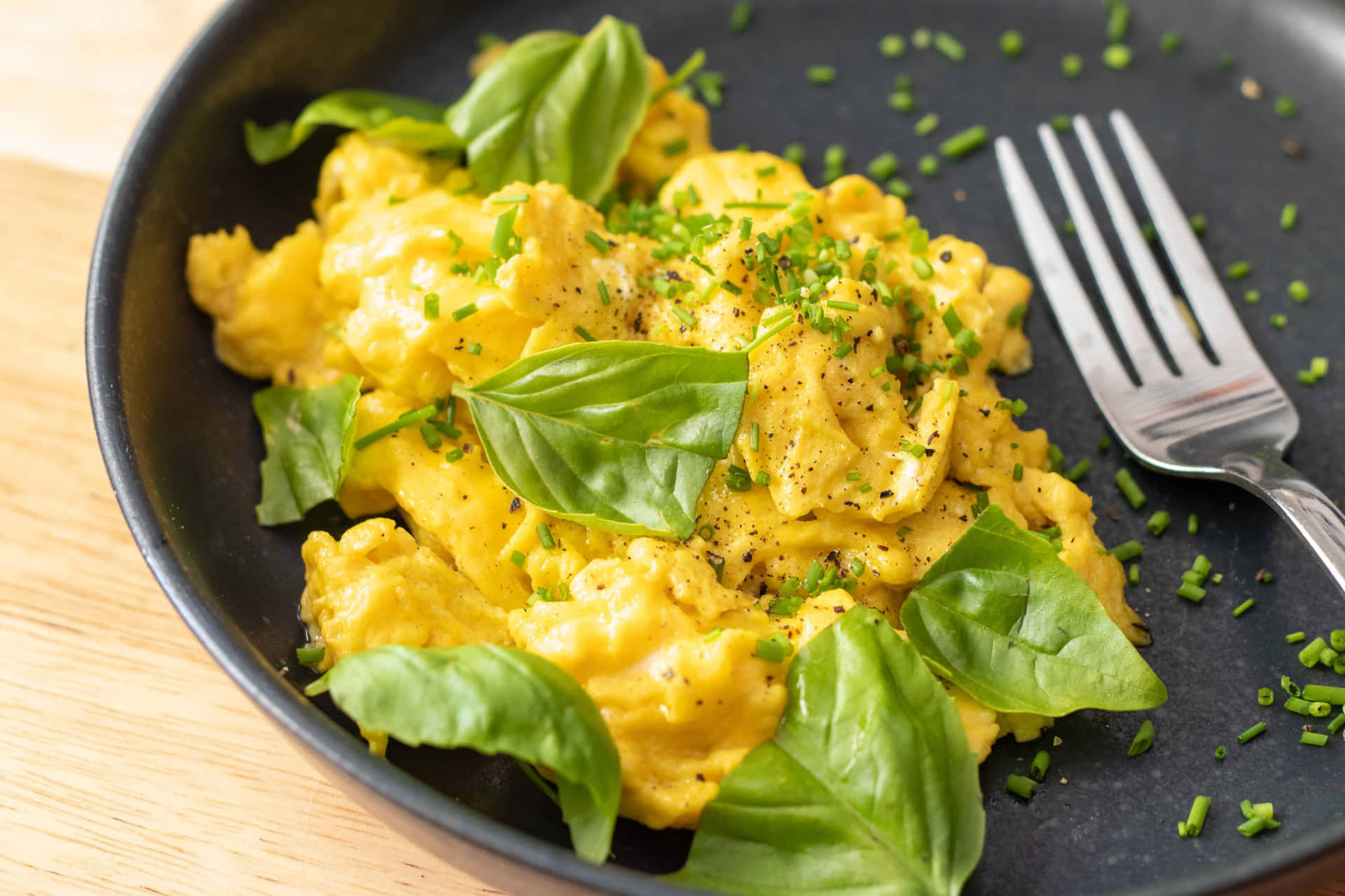 Scrambled Eggs With Basil On A Plate