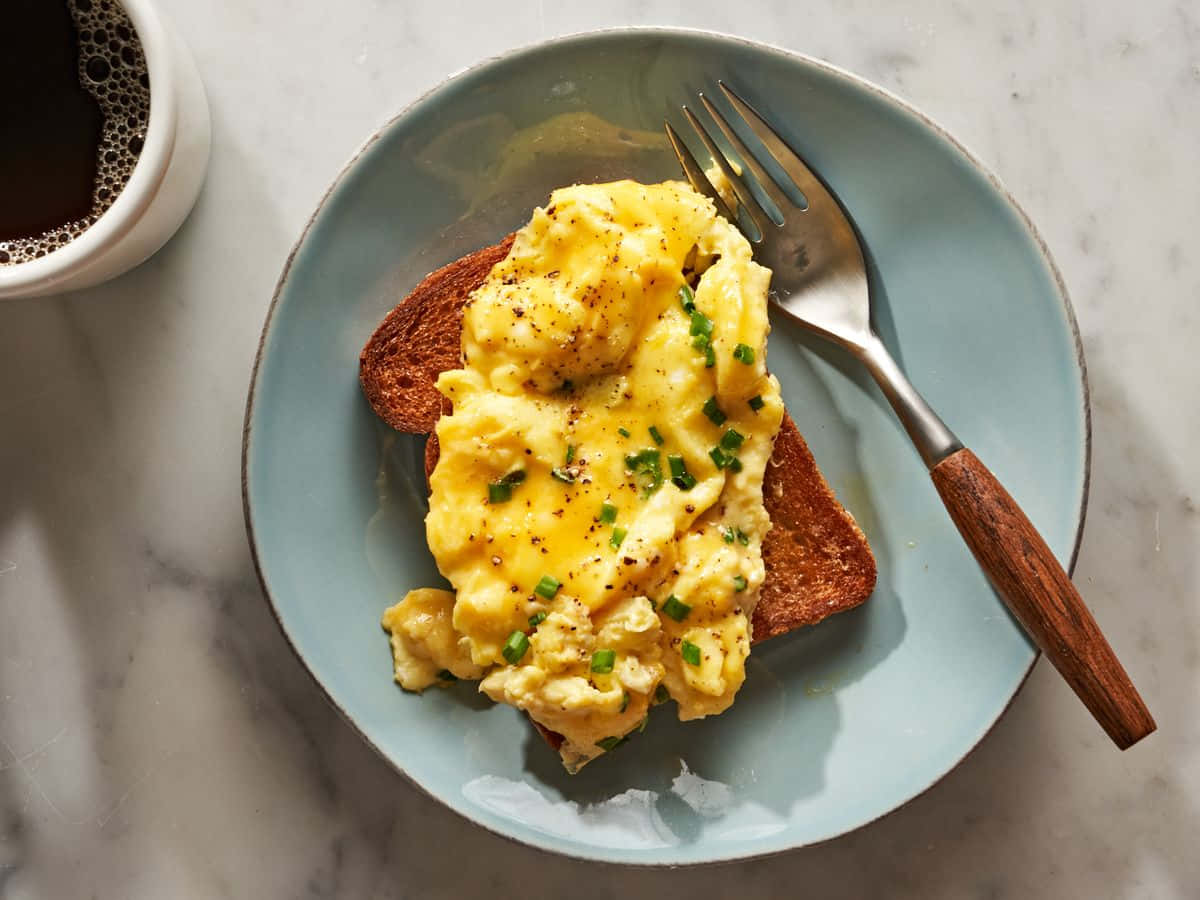 A hot plate of delicious, freshly-scrambled eggs.