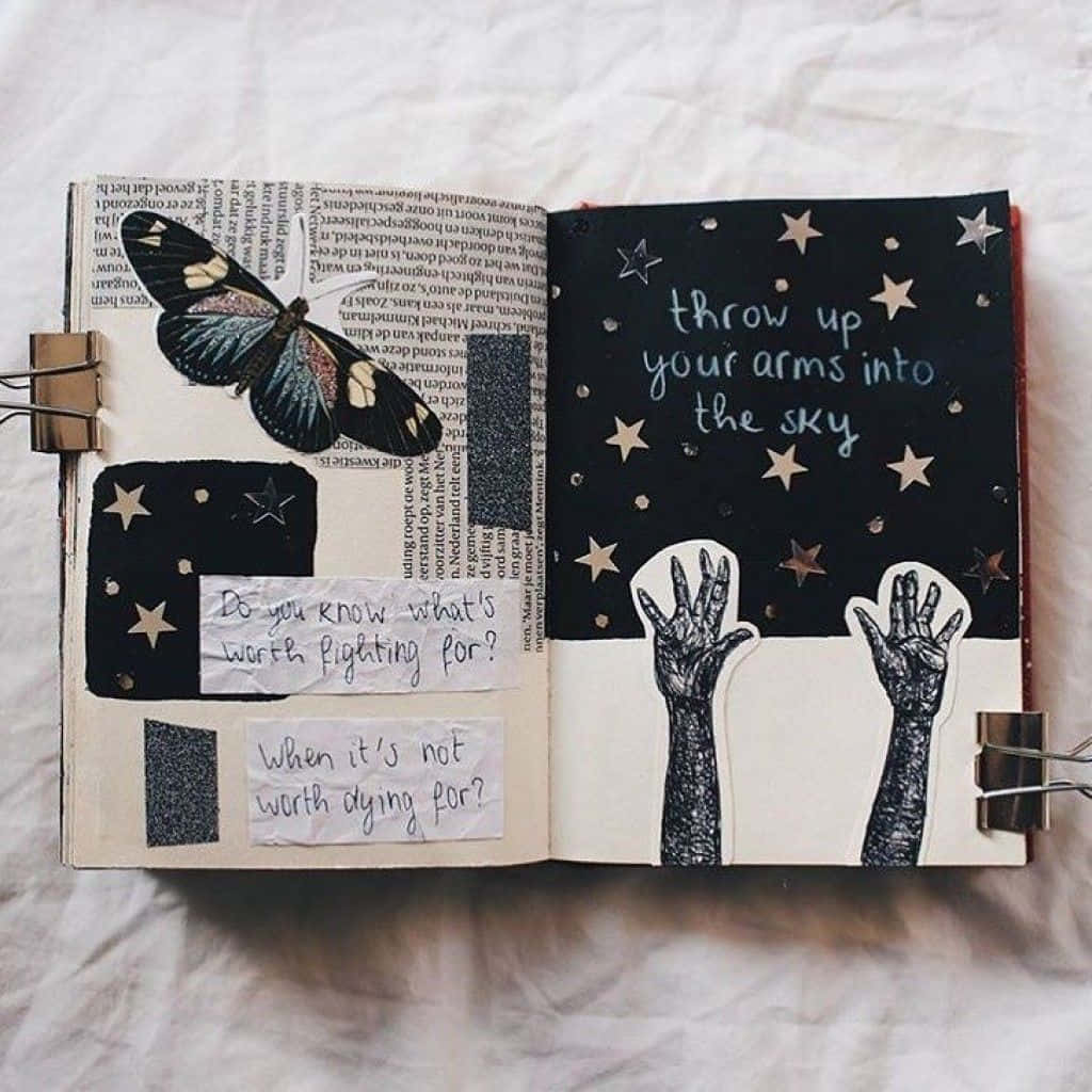 A Journal With A Hand Drawn Star And Butterflies