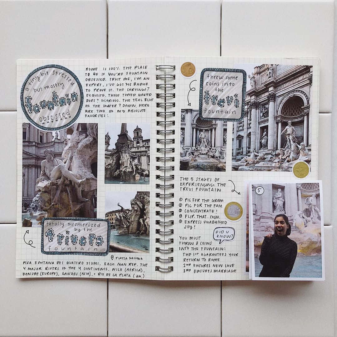 A Journal With Pictures Of A Statue And A Fountain