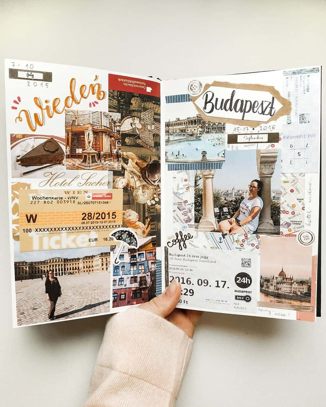 A Person Holding An Open Travel Journal With Pictures Of A City