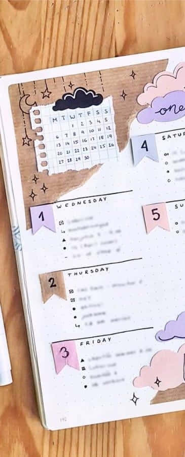 Download A Notebook With A Pen And A Calendar | Wallpapers.com