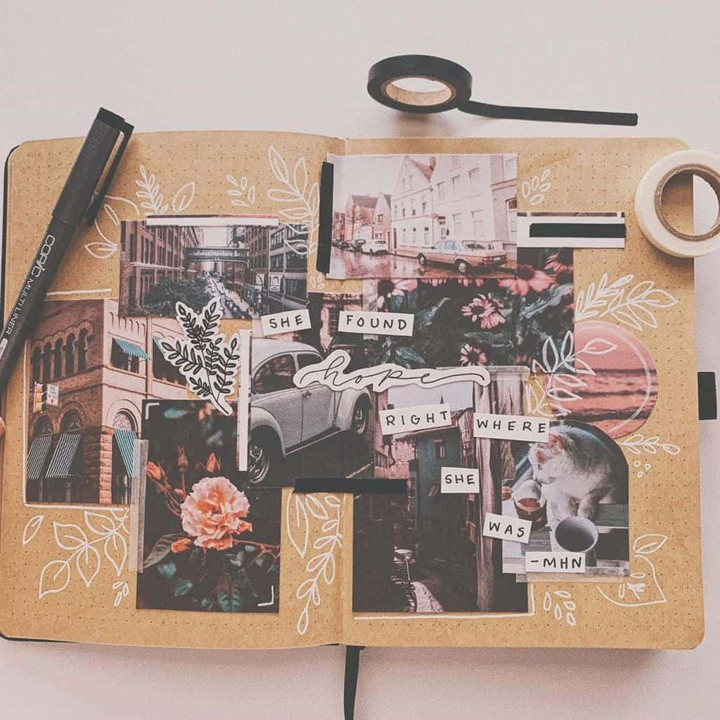 A Notebook With Photos And A Pen On It