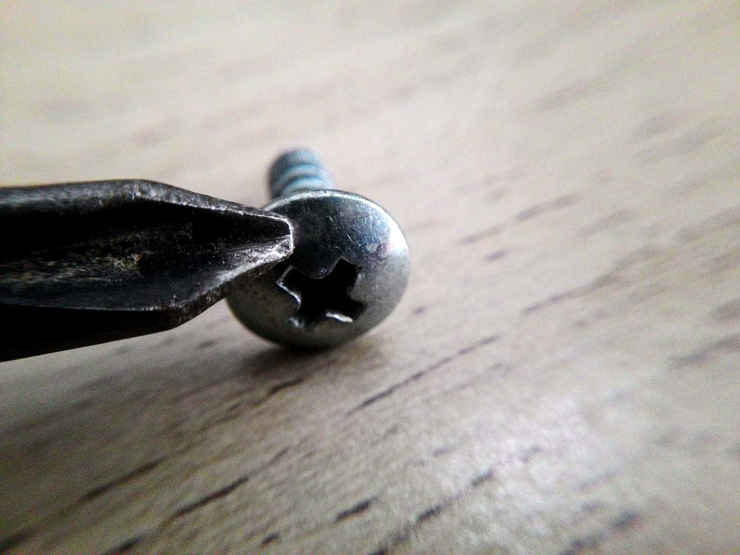 Close-up shot of a singular stainless-steel screw.