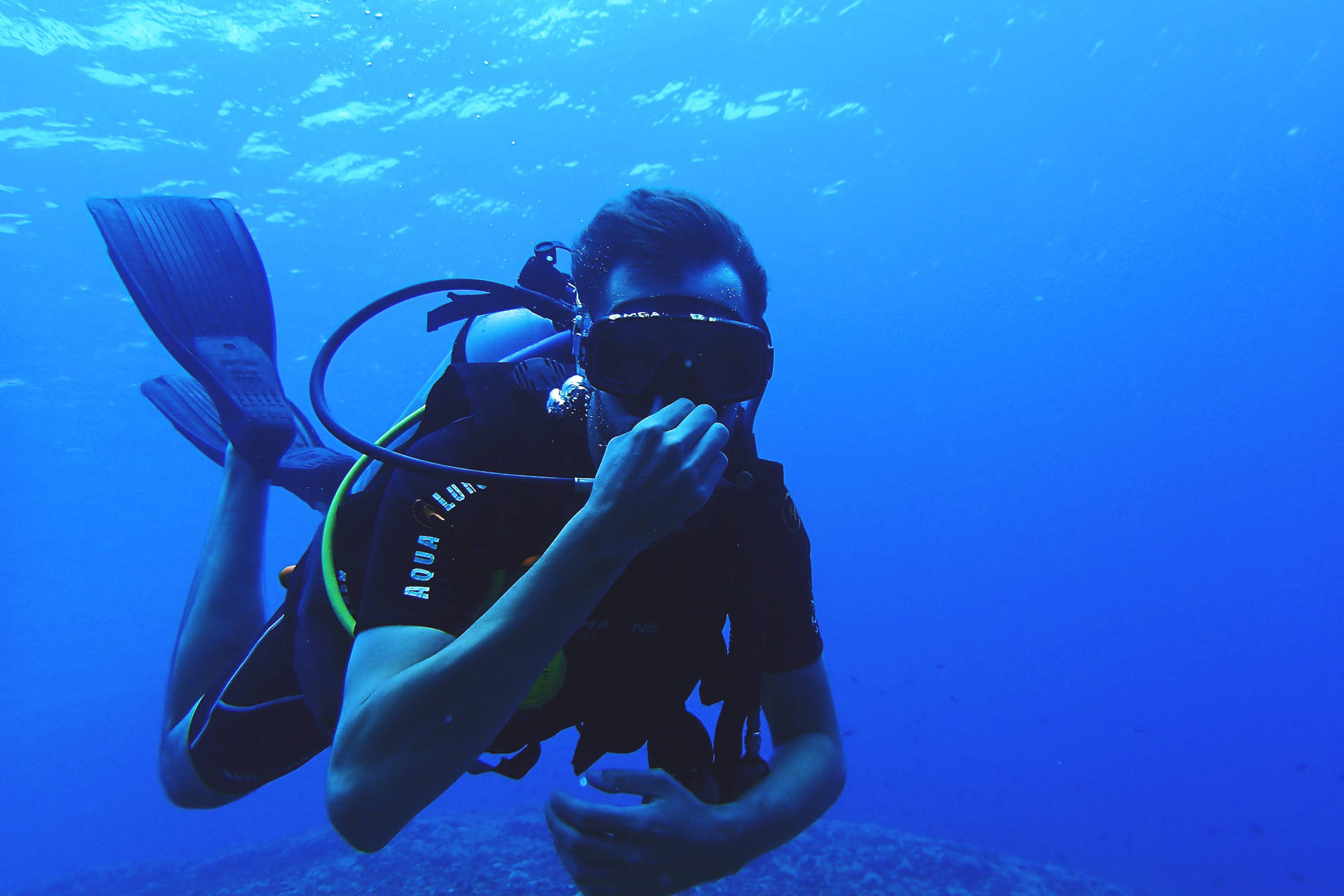 Breath-Taking Scuba Diving Adventure Under The Deep Blue Oceans Wallpaper