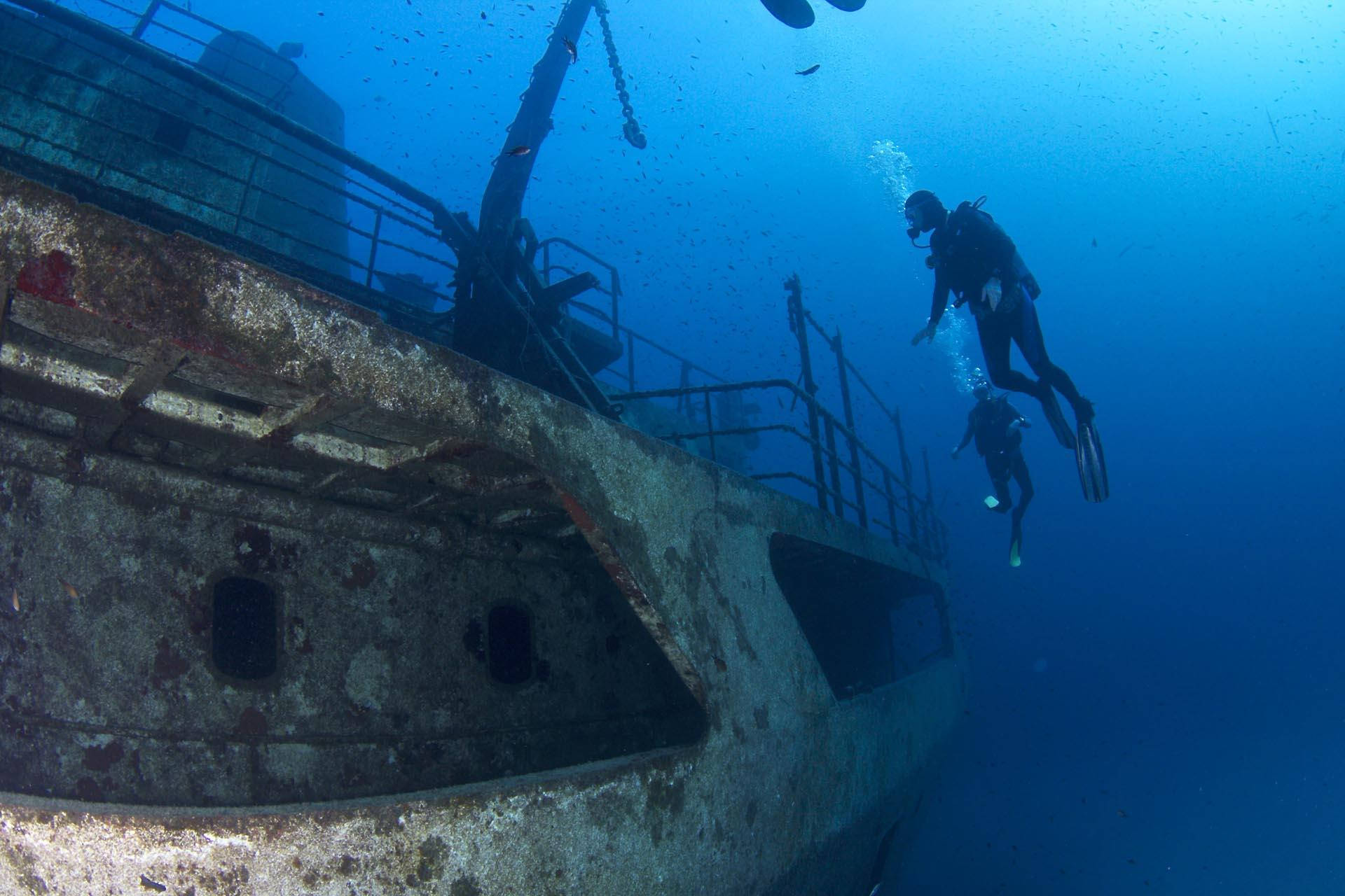 Scuba Diving Observing Sunken Ship Wallpaper