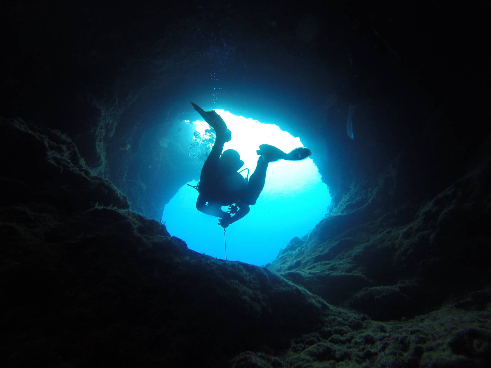 Scuba Diving Out Narrow Cave Wallpaper
