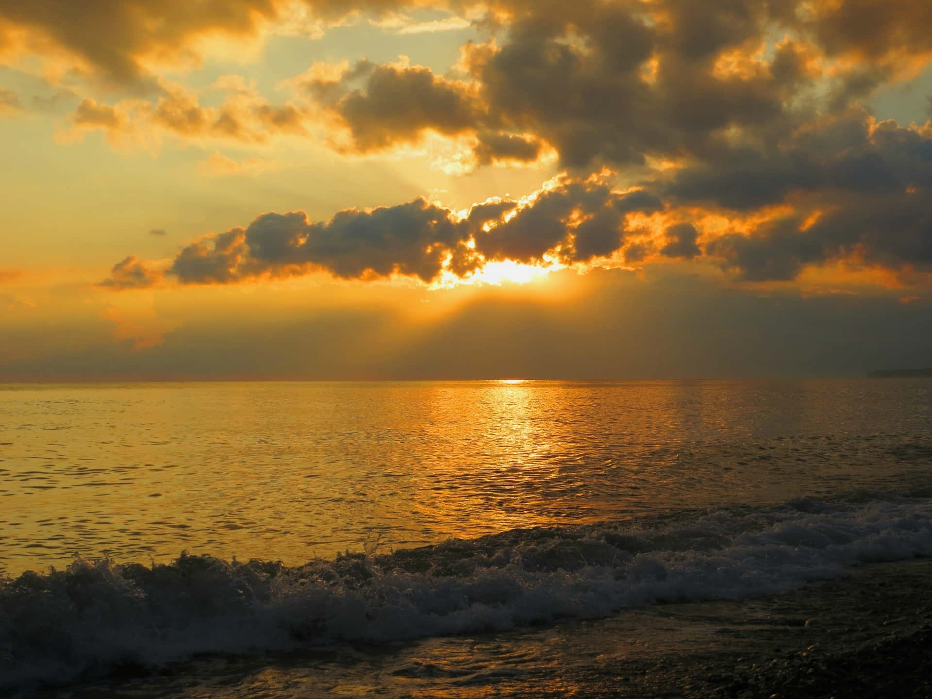 A Serene Sea Breeze At Sunset Wallpaper