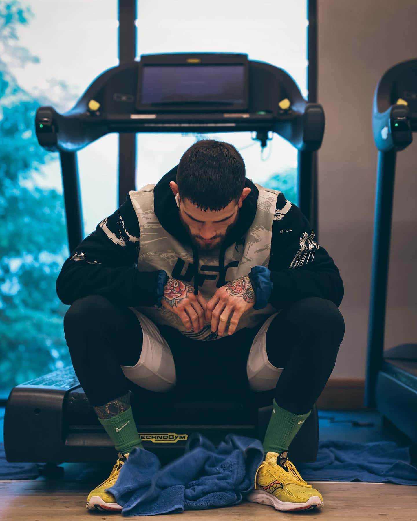 Sean Brady Sitting At Treadmill Background