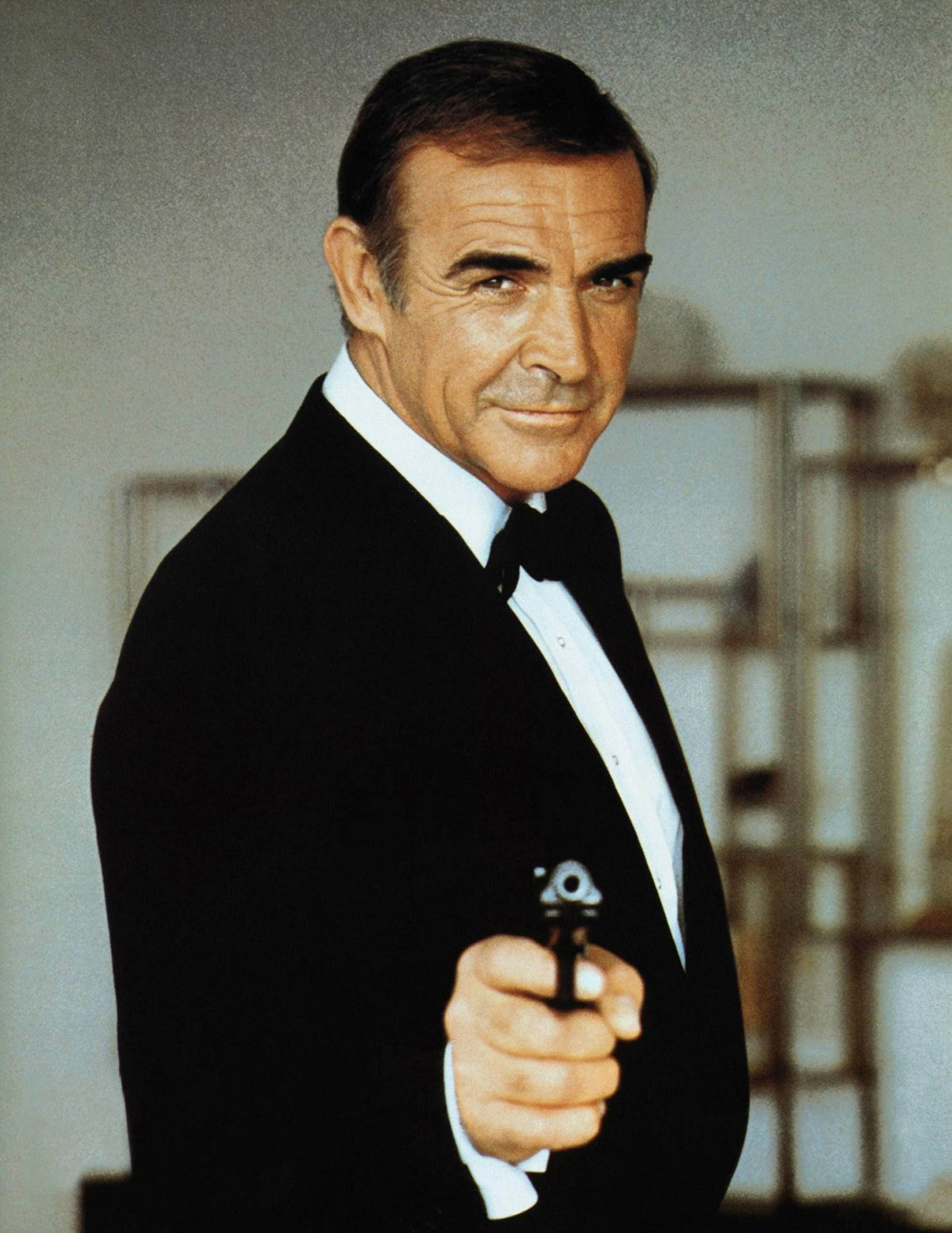 Sean Connery 1983 Gun Pose Wallpaper