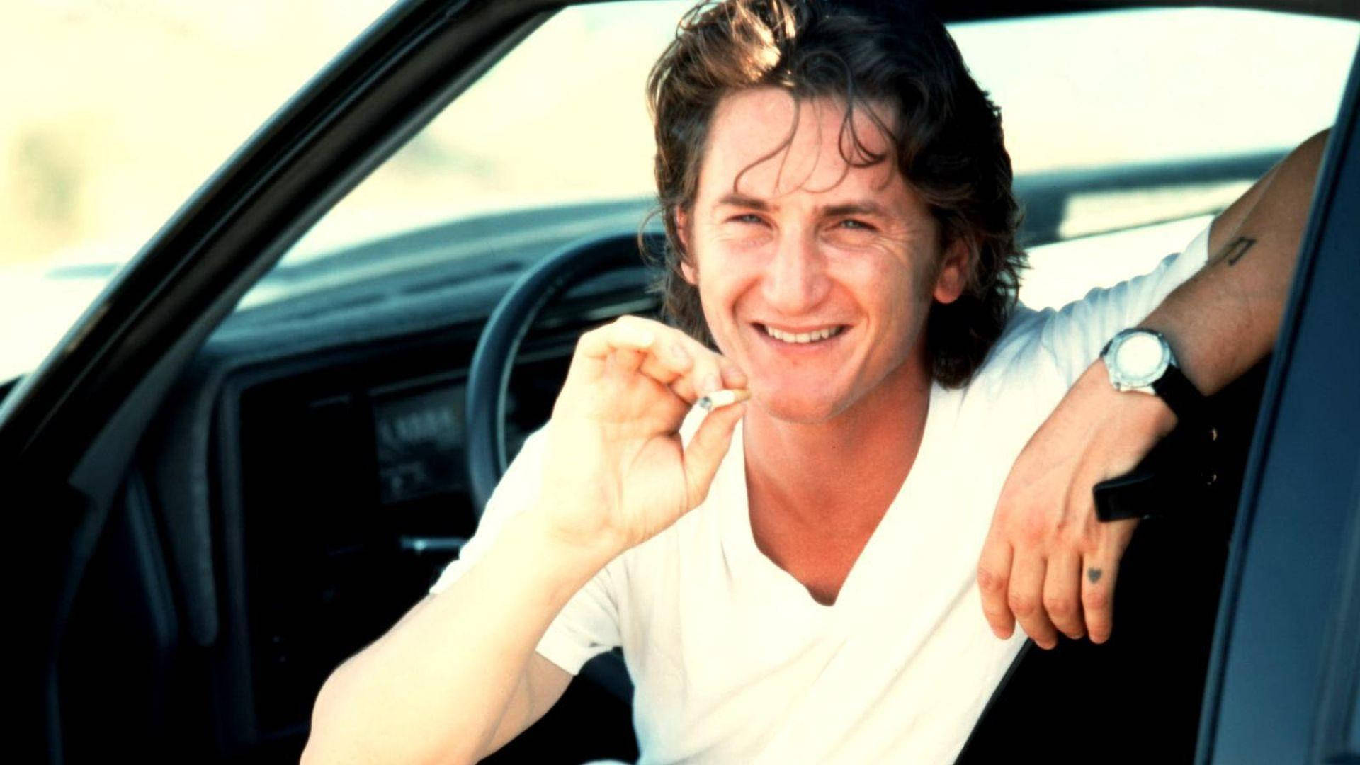 Sean Penn Sitting In A Car Wallpaper