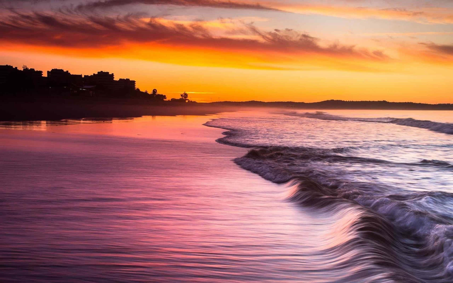 Serene Seashore at Sunset Wallpaper