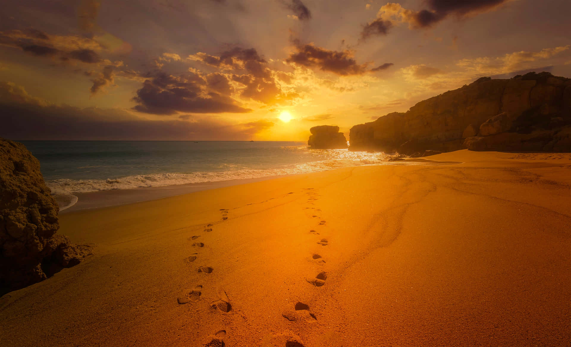 A Serene Seashore at Sunset Wallpaper