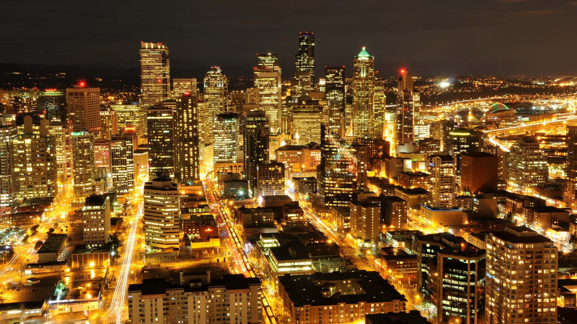 "take In The Breathtakingly Beautiful Night Skyline Of Seattle" Wallpaper