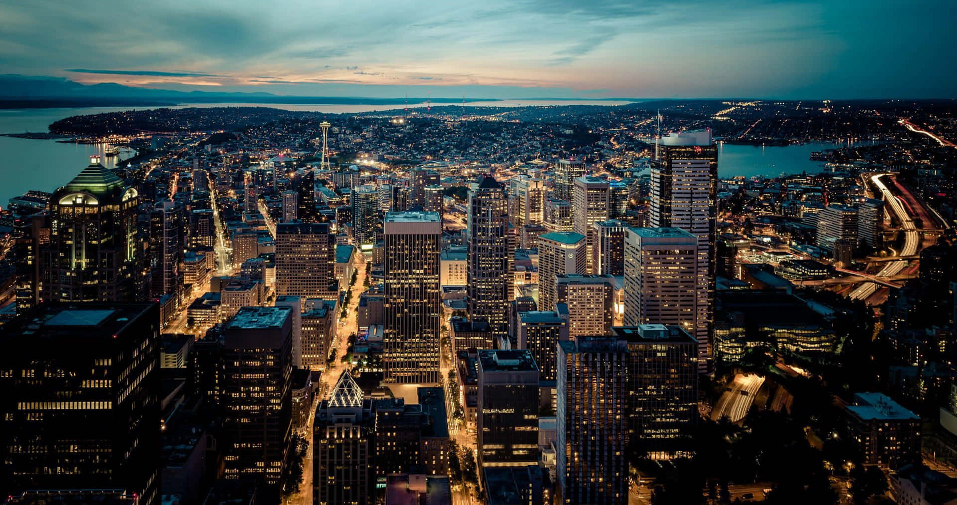 The Emerald City Glows: Seattle at Night Wallpaper