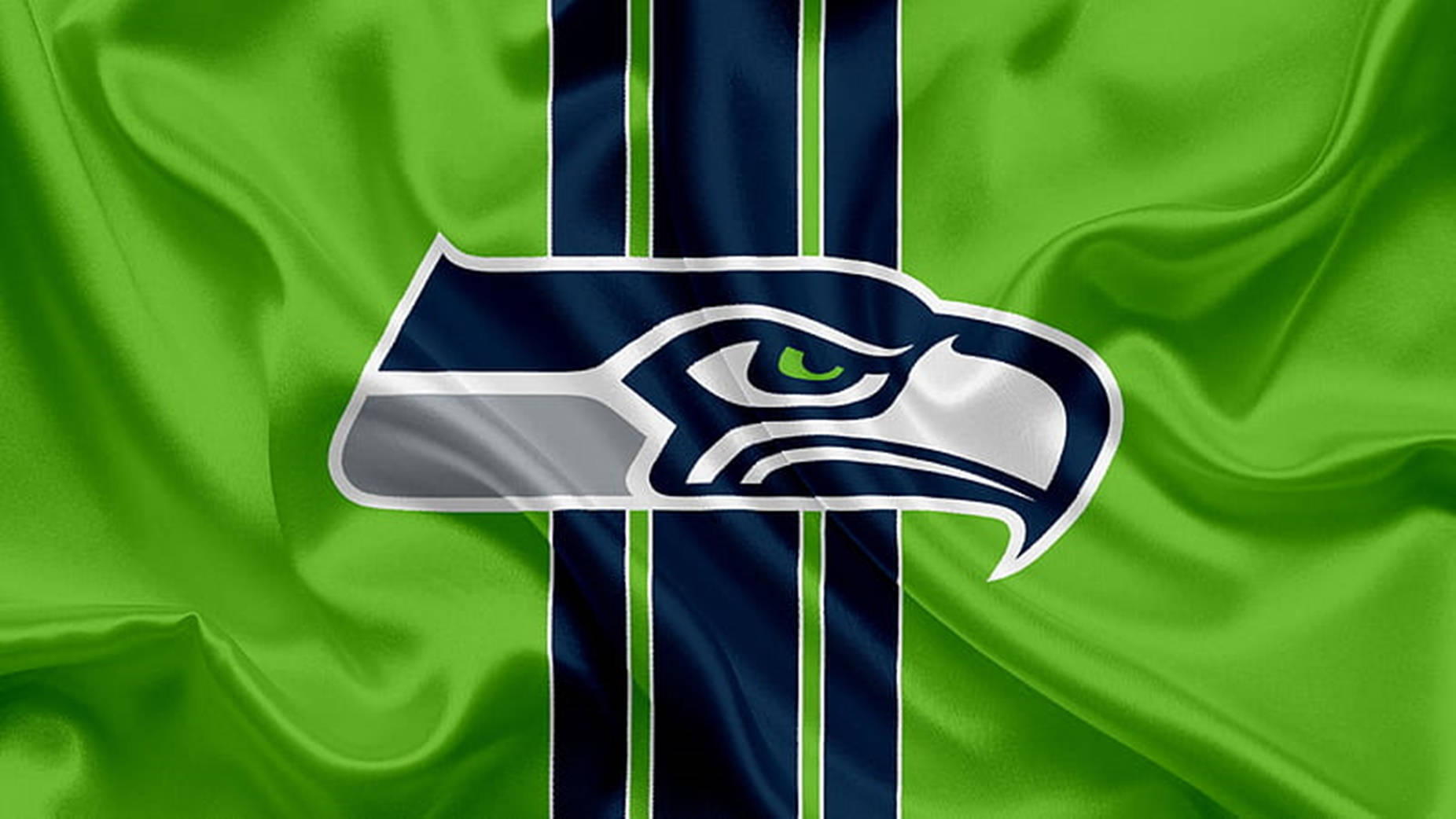Logotipode Los Seattle Seahawks En Una Bandera Verde Ondulante Fondo de pantalla
