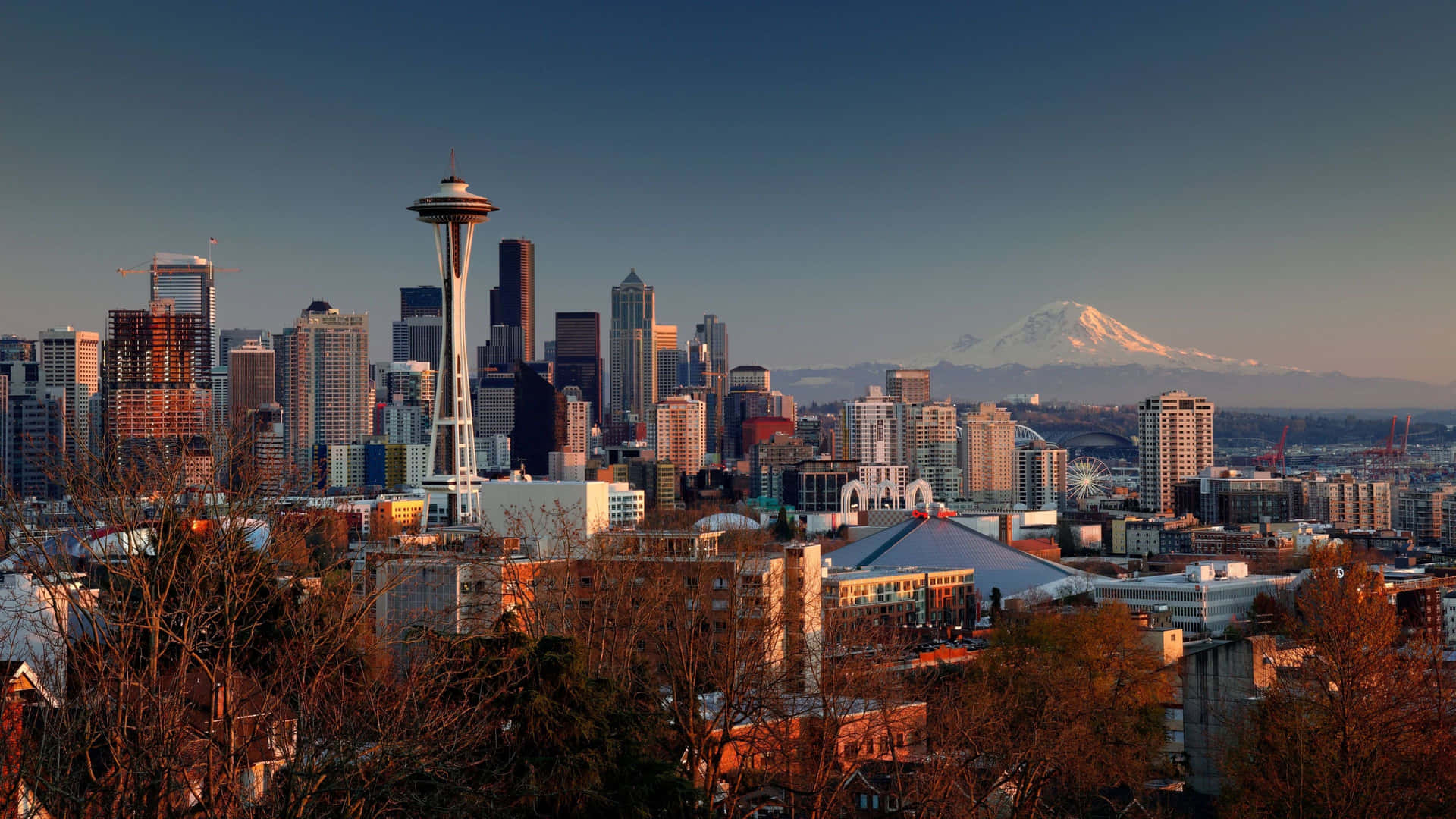 Seattle Skyline At Sunset With Mt Mccall In The Background Wallpaper