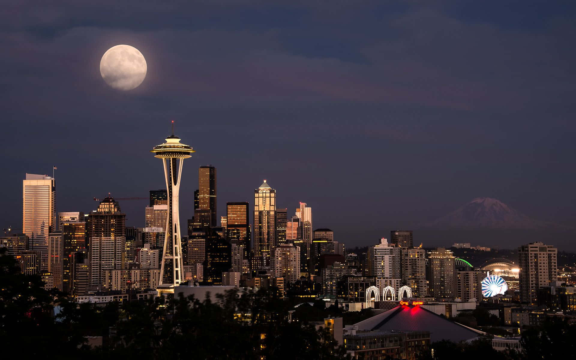 Seattle HD Moon Wallpaper — A full moon hangs over Seattle's skyline at dusk with the Space Needle and Mount Rainier visible.