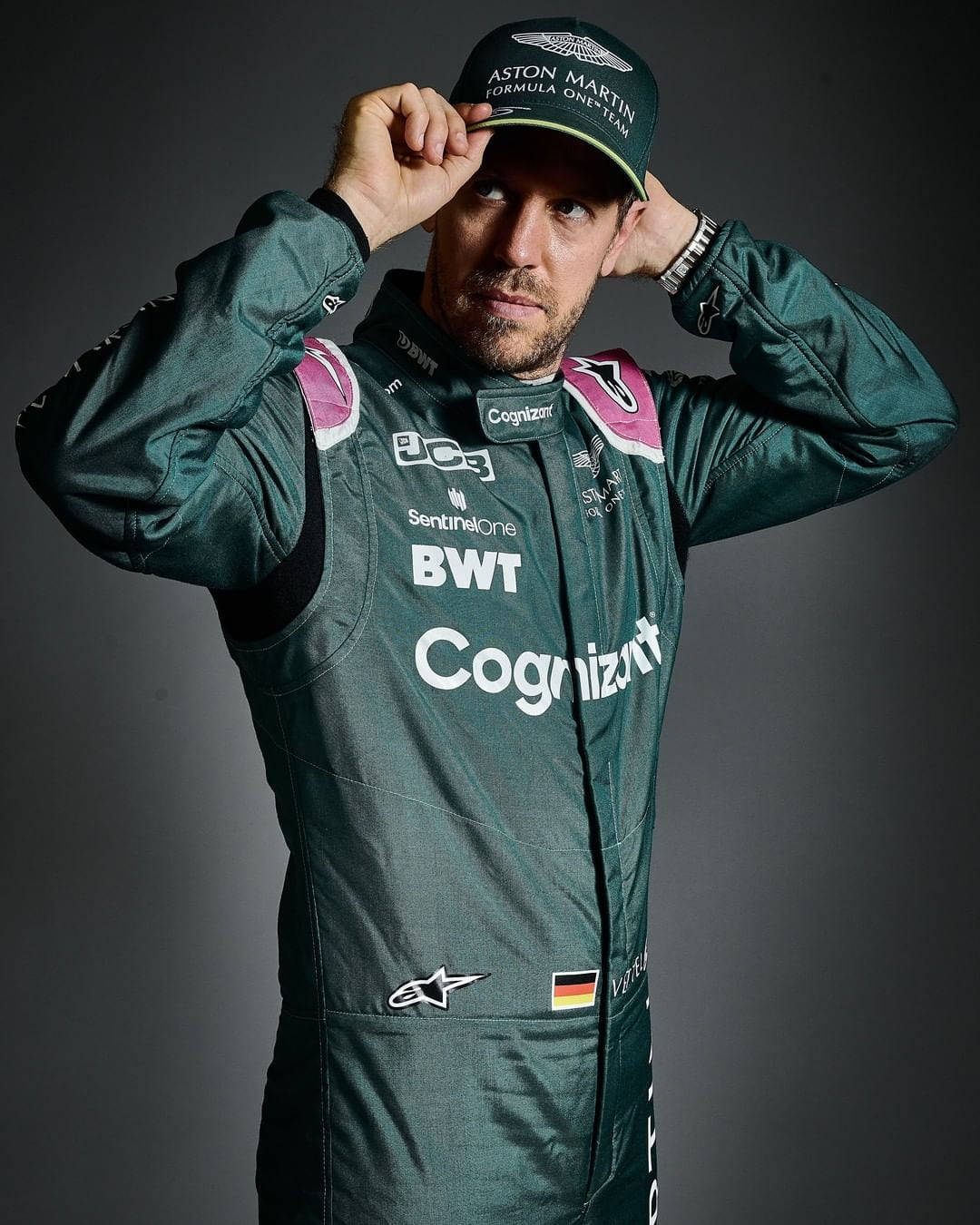 Sebastian Vettel Green Suit And Cap Wallpaper