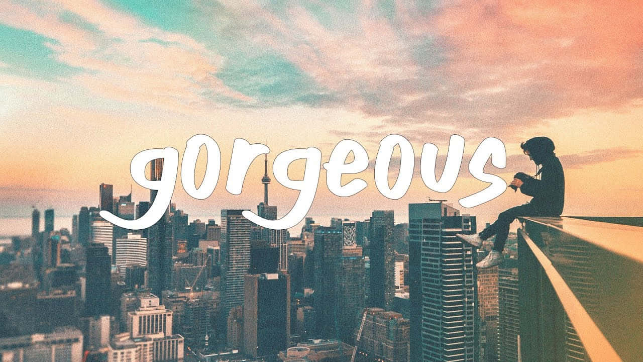 A Person Sitting On A Ledge With The Word Gorgeous Written On It Wallpaper