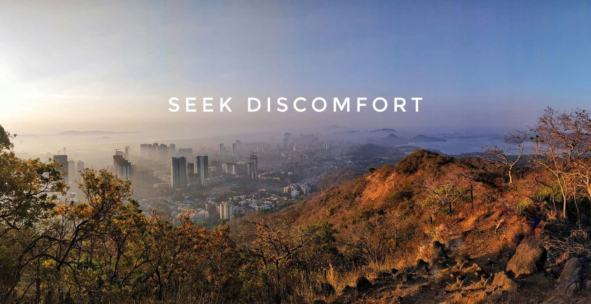 Seek Comfort - A City With Mountains And A City Wallpaper