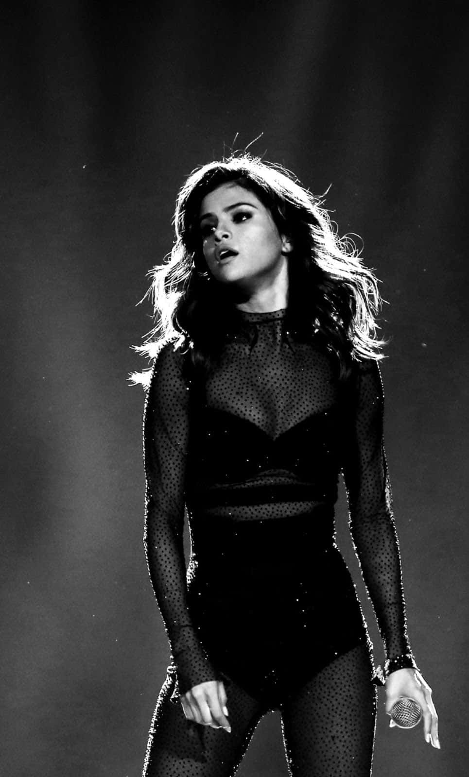 Bold and Beautiful - Selena Gomez stuns while using her Iphone Wallpaper