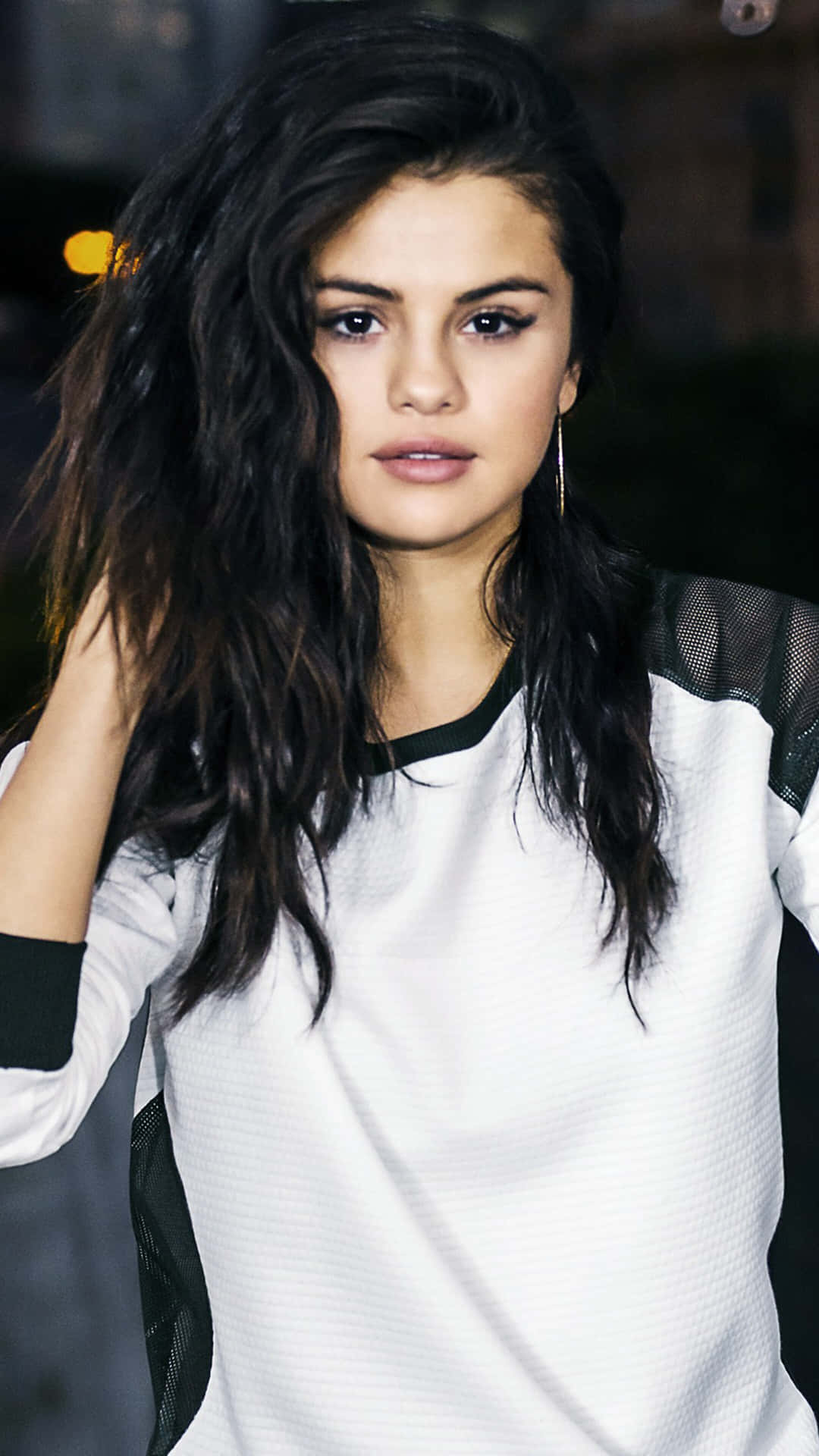 Selena Gomez Showing Off Her New iPhone Wallpaper