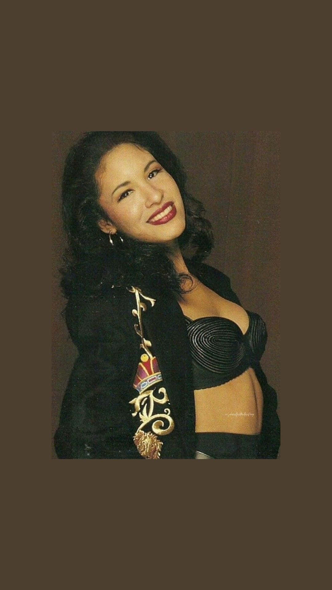 Feel the love and power of Selena Quintanilla with this exclusive iPhone Wallpaper
