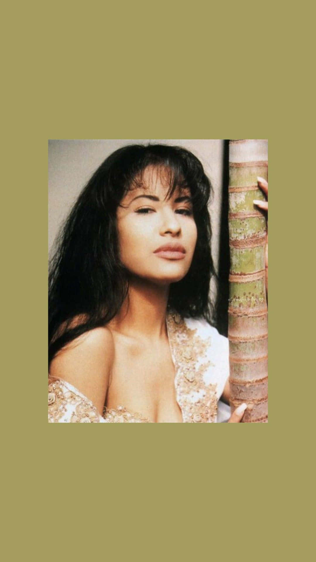 Women empowerment with Selena Quintanilla's iconic image on your iPhone Wallpaper