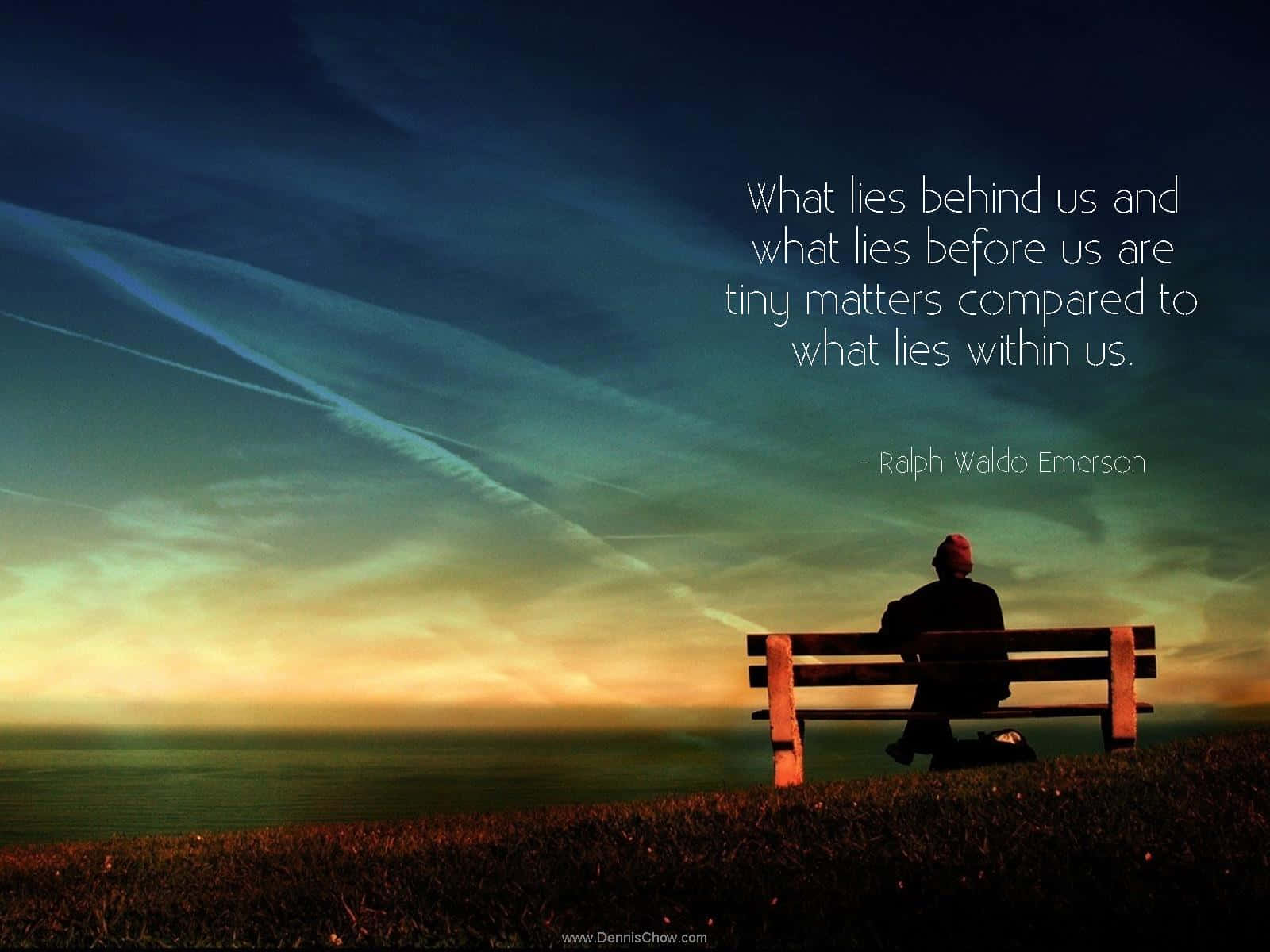 A Man Sitting On A Bench With A Quote Wallpaper