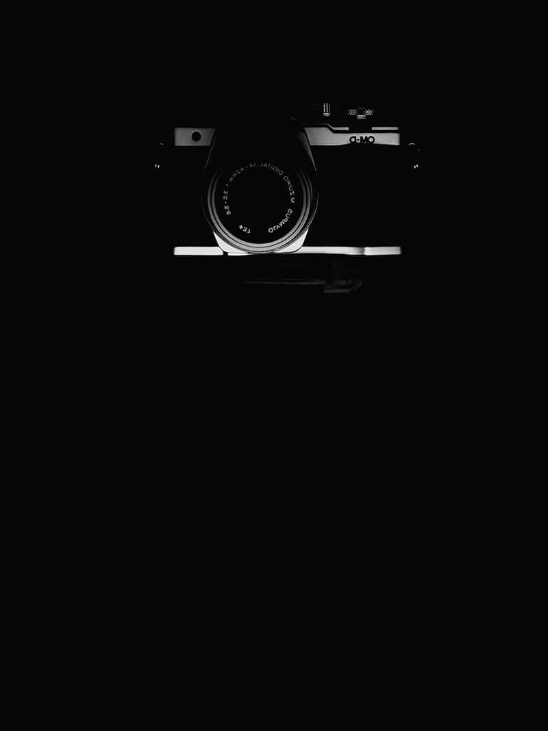 A Black And White Photograph Of A Camera