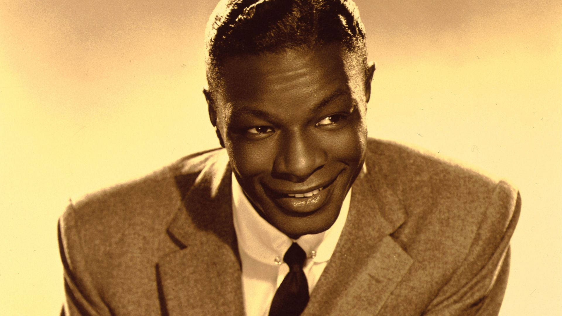 Sepia Style Portrait Of Nat King Cole Wallpaper