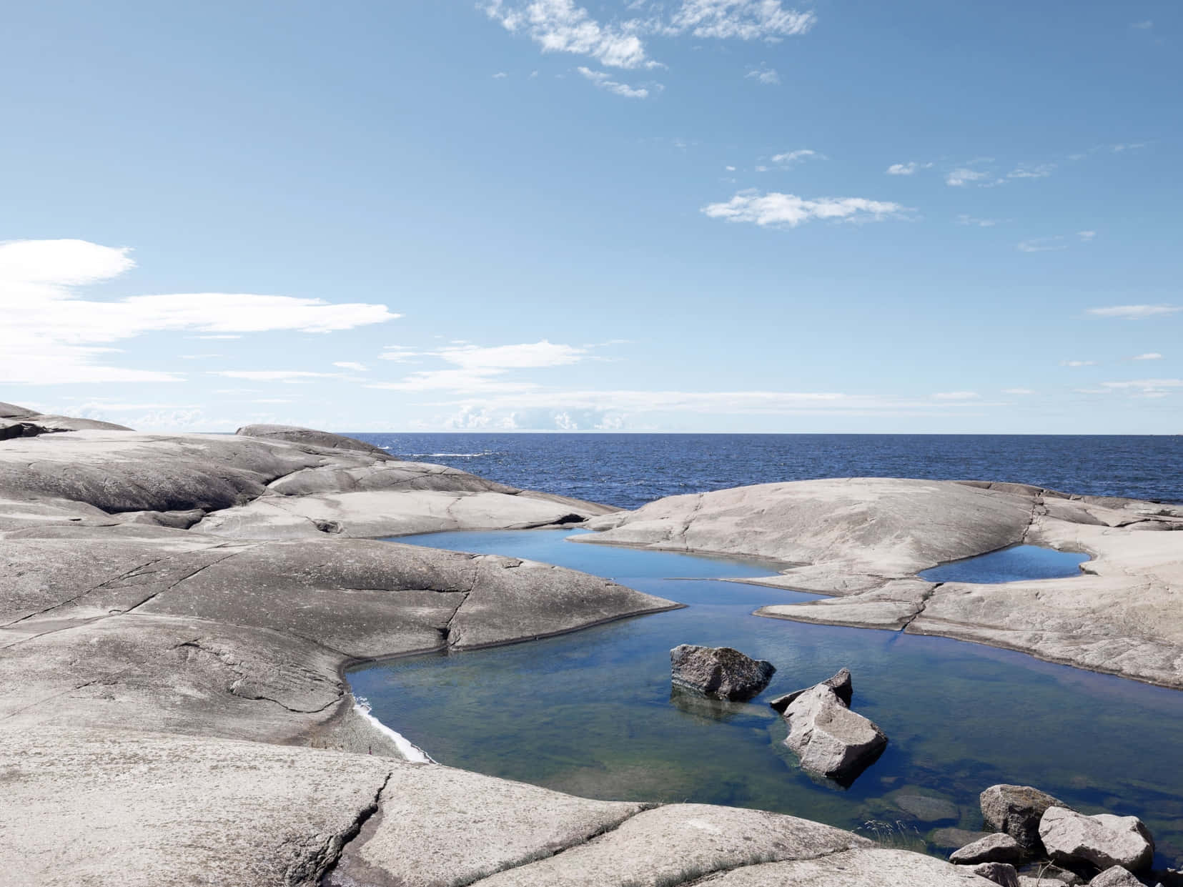 Serene Archipelago Rocksand Water Wallpaper
