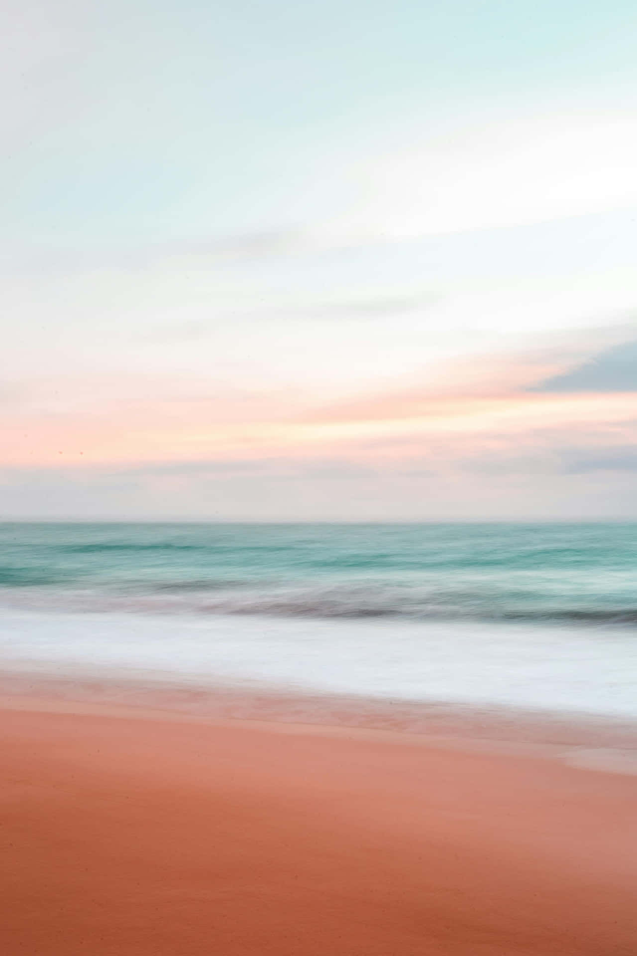 Serene Beach Sunset Blur Wallpaper