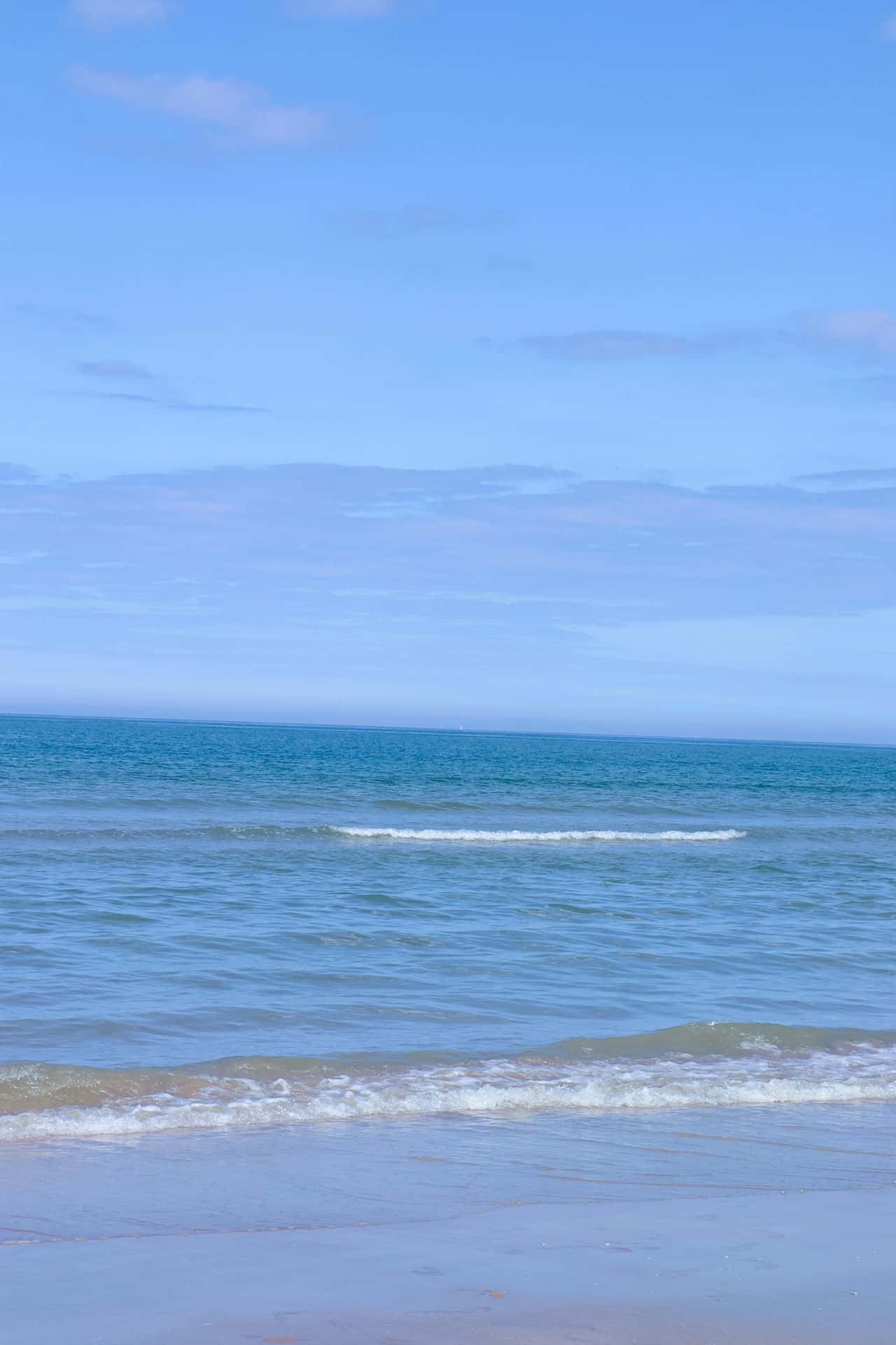 Serene Blue Beach Scape Wallpaper