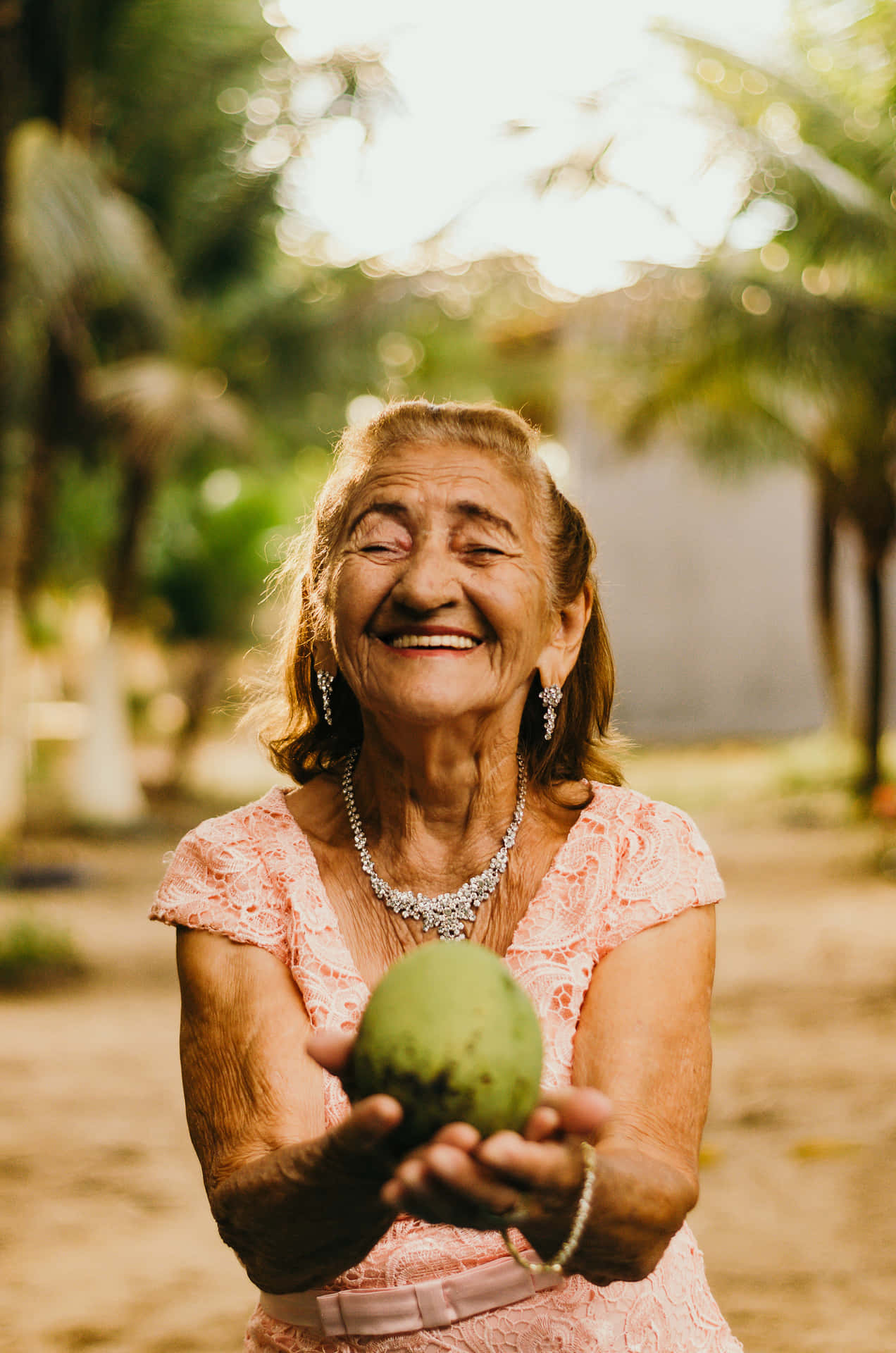 Serene Elderly Woman Enjoying Nature Wallpaper