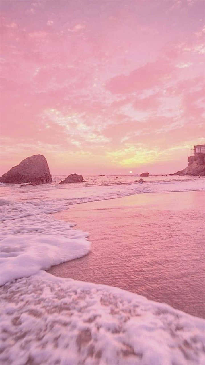 Serene Pink Beach Sunset Wallpaper