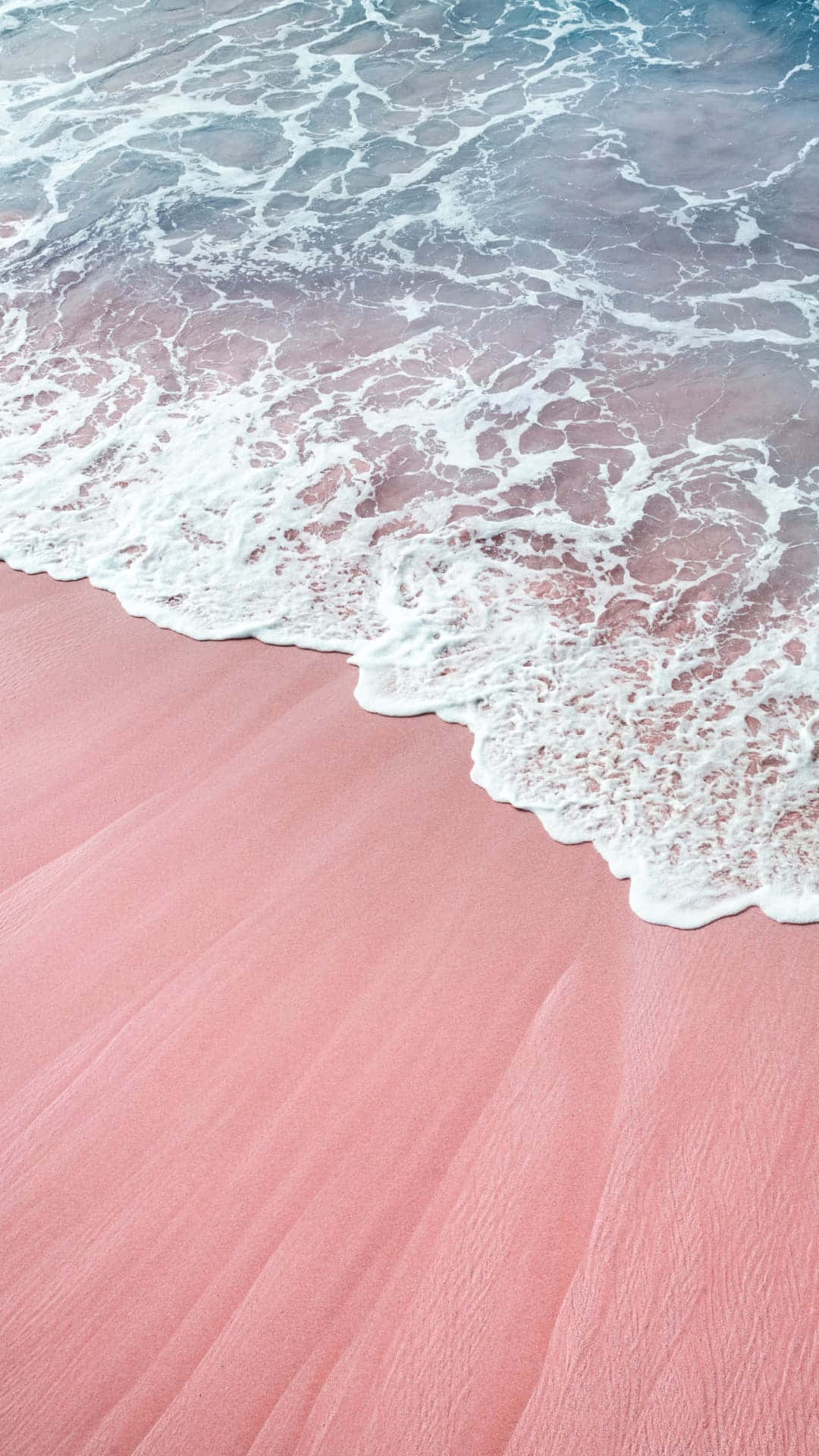 Serene Pink Sand Beach Waves Wallpaper